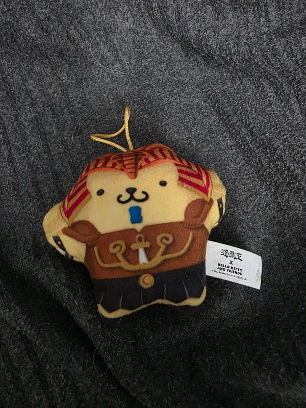 Pompom Purin dressed as Exodia