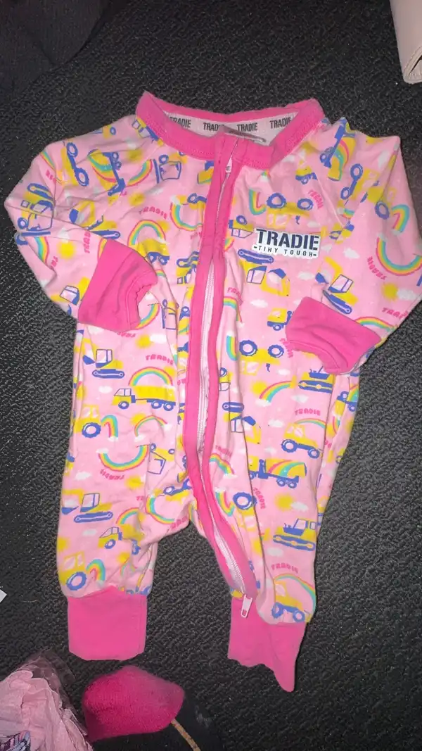 Tradie girls onesie pink trucks