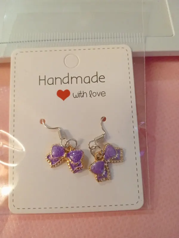 Purple bow tie earrings