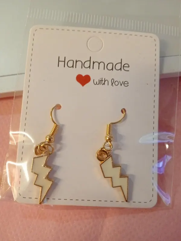 White lightning bolt earrings