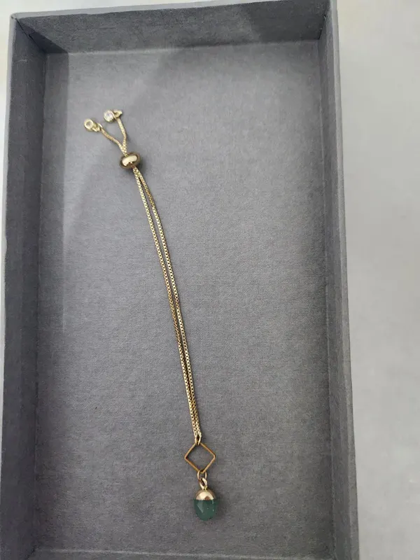 Gold tone adjustable slider bracelet