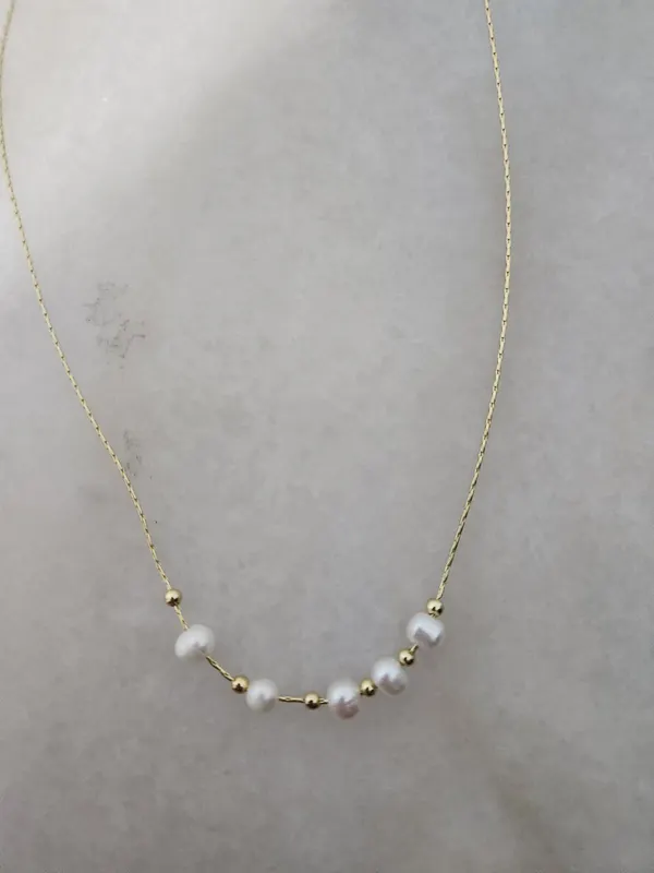 Gold tone adjustable pearl necklace
