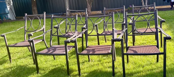 Metal and woven outdoor armchairs