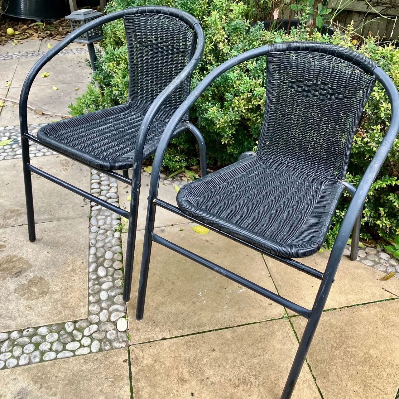 Two black outdoor stacking bistro chairs — photo 3