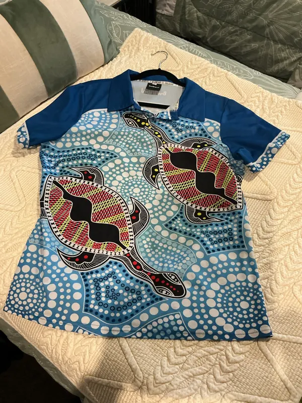 Vibrant Tribal Turtle Polo Shirt