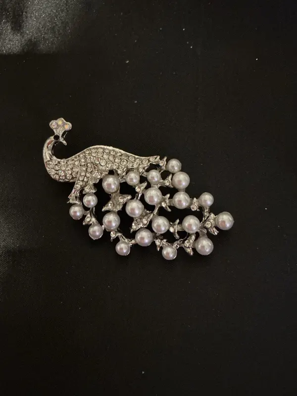Elegant Pearl and Silver Peacock Brooch