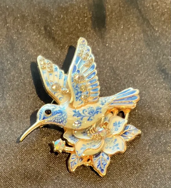 Gold tone enamel hummingbird brooch
