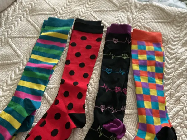 four pairs of funky sock co compression socks women’s size 7 to 8