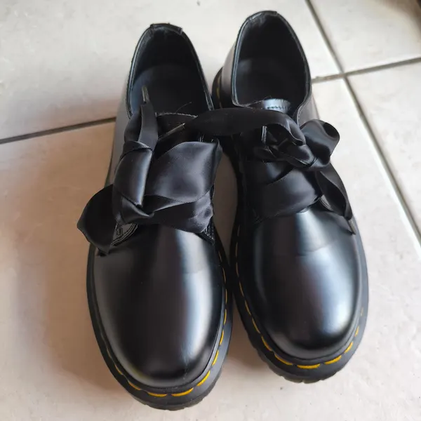 Black Dr. Martens Mary Jane shoes with bow detail