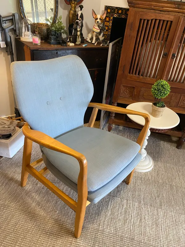 Blue occasional chair and pedestal table
