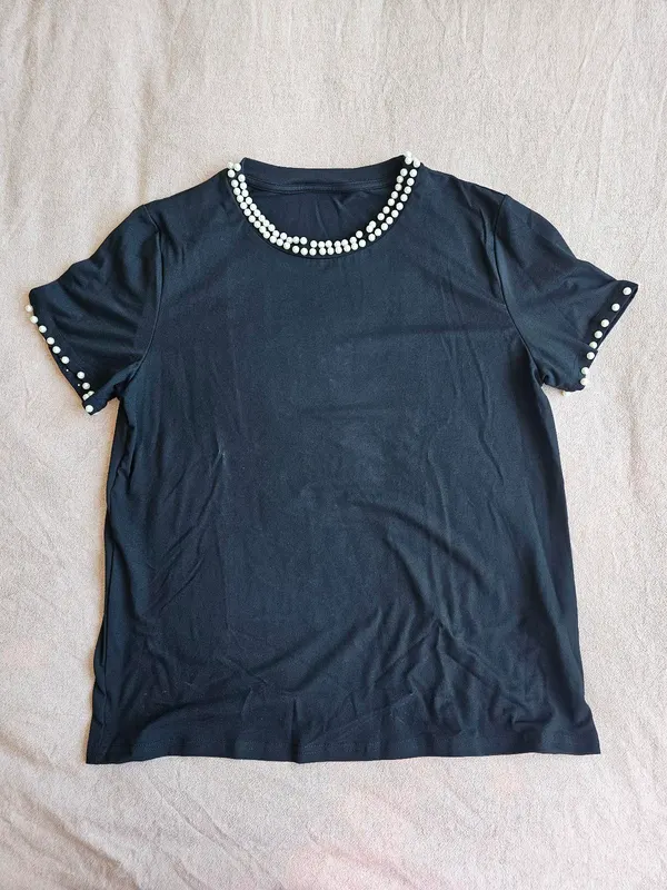 Black pearly shirt Size would fit M/L