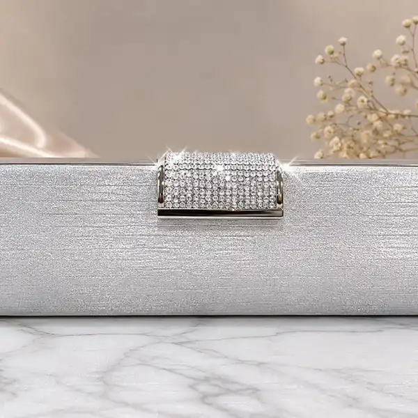 Silver clutch with statement rhinestone clasp