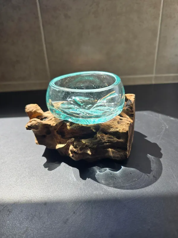 Glass bowl vase on wood