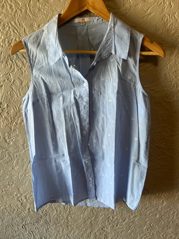 Target light blue sleeveless white floral print shirt
