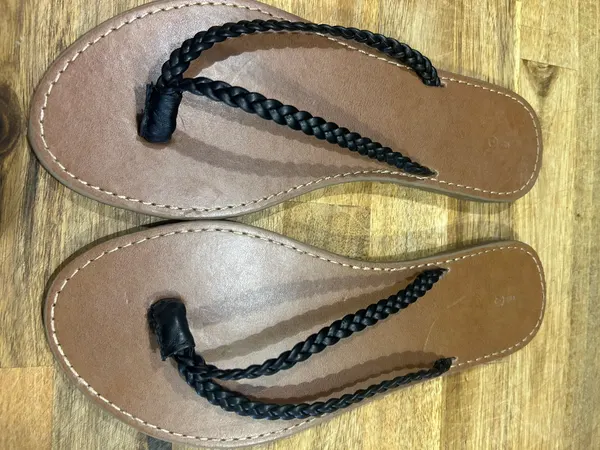 Women’s brown thongs with black braided straps