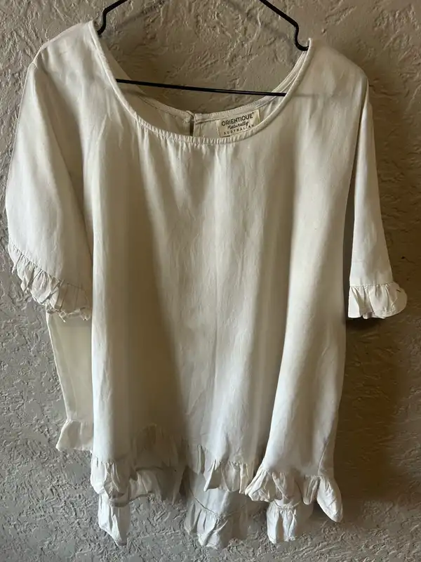Orientique cream ruffled blouse