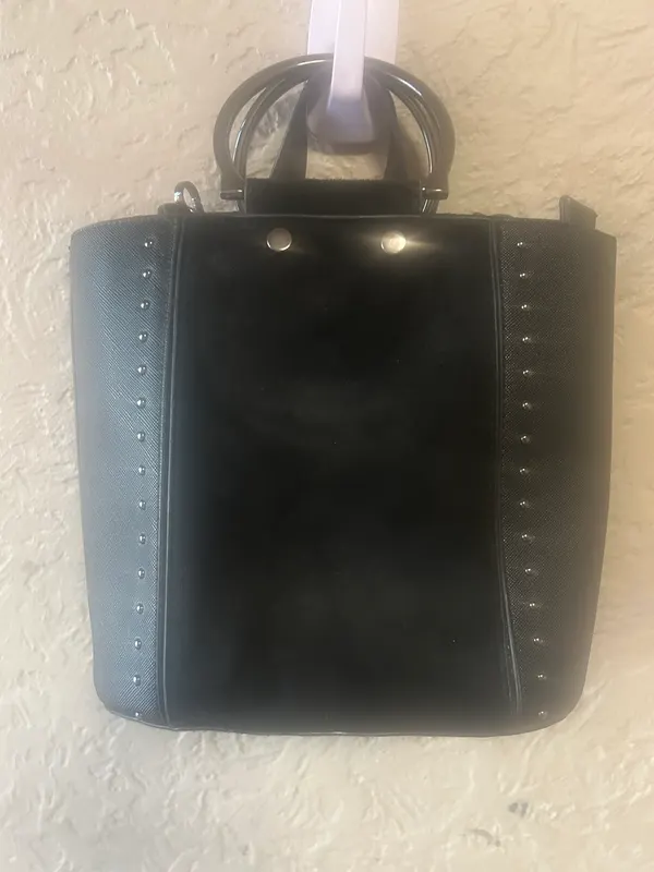 Small black handbag with metal handles