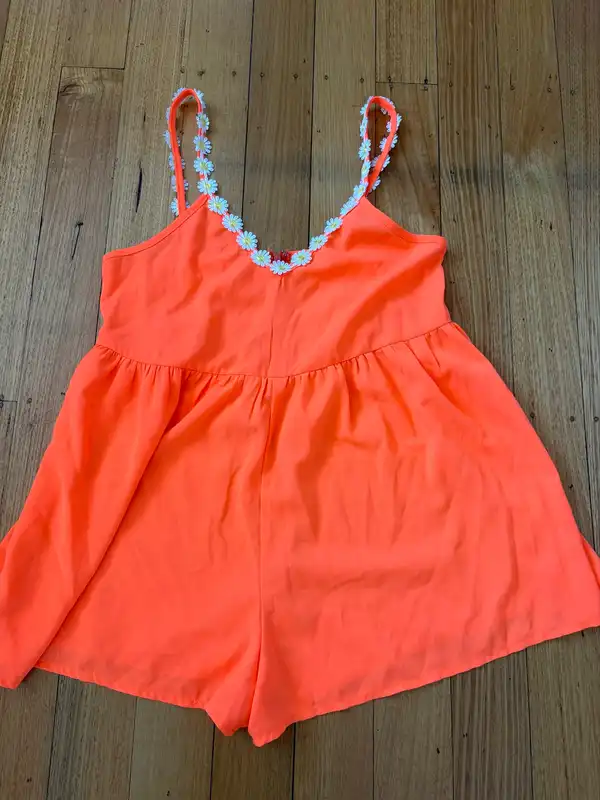 Ho doesn’t know why?  Orange Strappy Playsuit Daisy Embroidered Trim Size 10