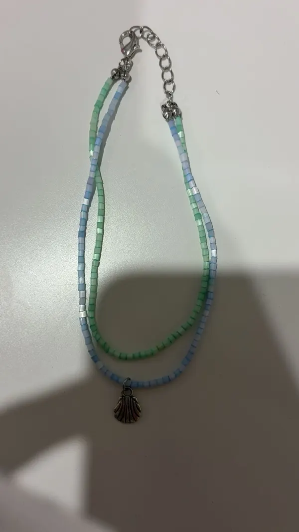 Blue and green beaded anklet with silver shell charm